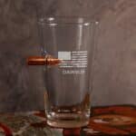 Patriotic bar glass with embedded bullet