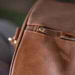Brown vegan leather duffle bag zipper