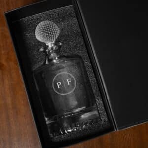 Golf decanter show in black gift box with custom circle groomsmen monogram design
