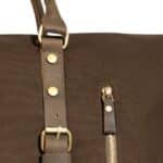 Close-up of The Langston's adjustable shoulder strap and front side zipper