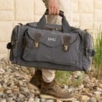 The Long Weekend bag shown in charcoal grey with custom embroidery in white thread