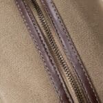 Close-up of the brown vegan leather zipper on the Alderman Personalized Toiletry Bag