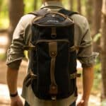 The charcoal grey Pathfinder bag shown being worn as a backpack.