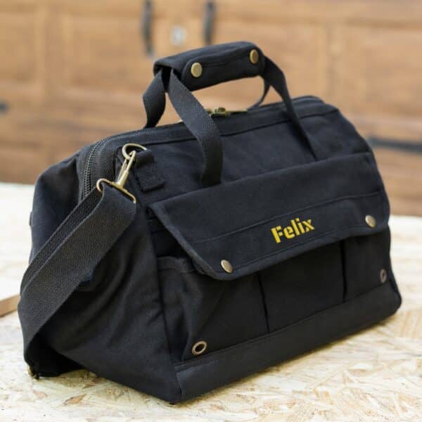 Black tool bag with custom yellow thread