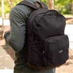 Black backpack embroidered with custom initials
