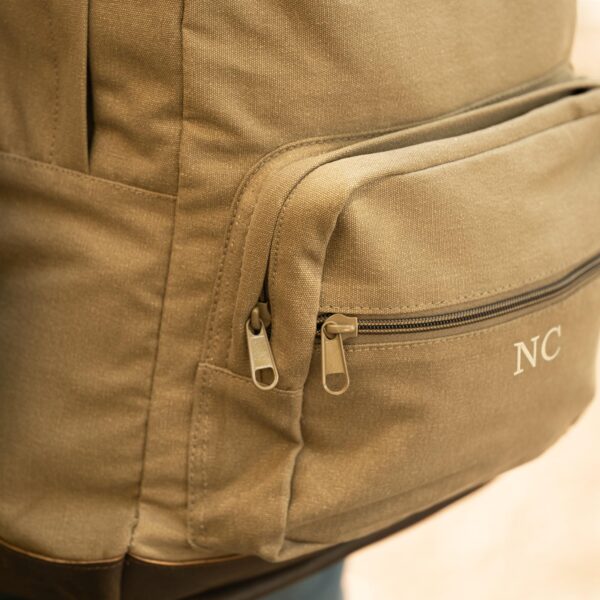 Front zippered pockets on green backpack