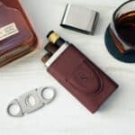 Football-textured cigar holder with precision cutter and custom engraving