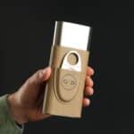 Man holding a tan cigar case