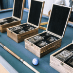 Groomsmen gift decanter box sets lined up on a pool table
