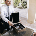 A proud groomsman receiving his custom whiskey decanter set