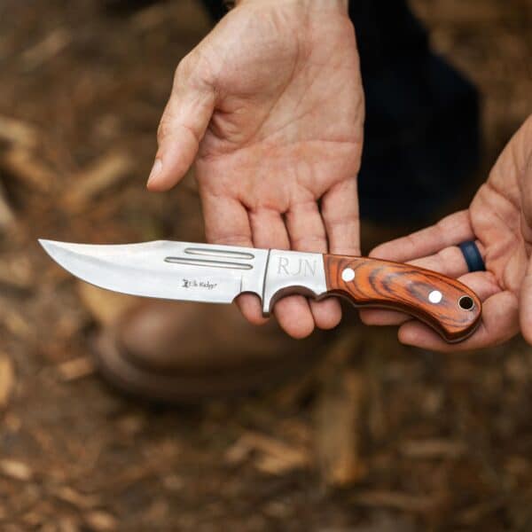 Elk Ridge Fixed Blade Knife displayed in hands