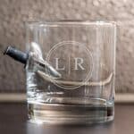Embedded knife rocks glass with 1 circle monogram design