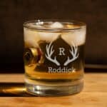 Shotgun shell whiskey glass with antler monogram design