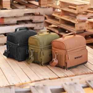Three lunch coolers sitting on a pile of wood pallets