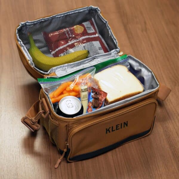 Brown lunchbox shown with a full, chilled lunch inside