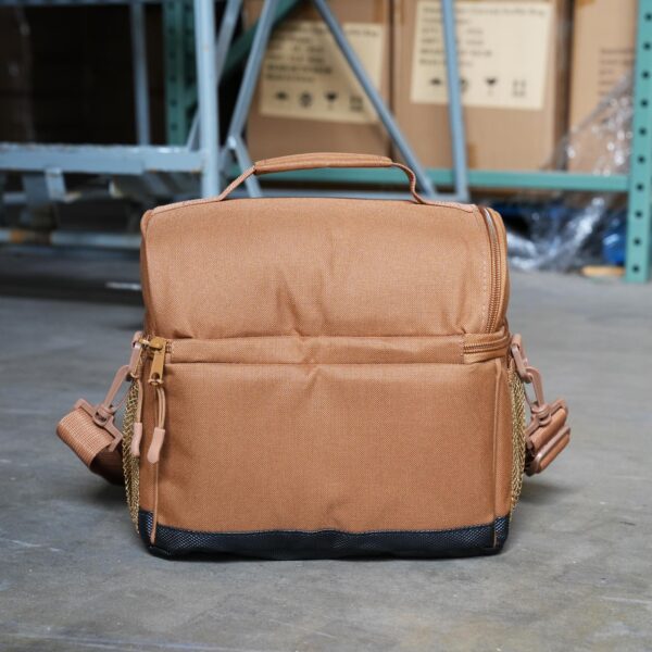 Backside of the brown lunch cooler shown in a warehouse setting