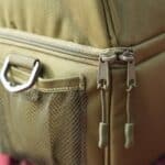 Close-up of the zippers on the green personalized lunch cooler