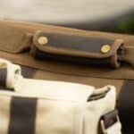 Close-up of leather handles on laptop bag
