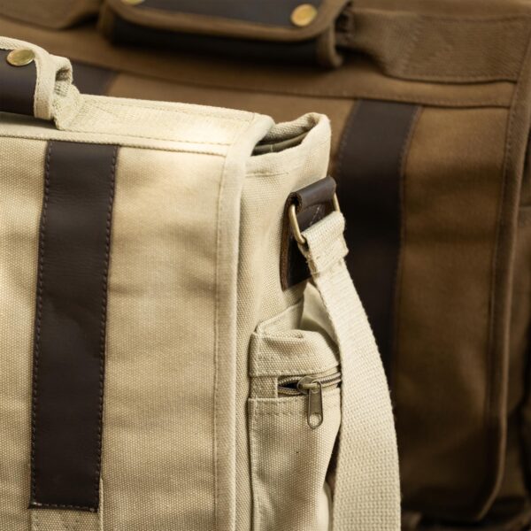 Close-up of buckle and hardware on khaki laptop bag