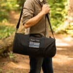 Man holding his Thin Blue Line bag over the shoulder