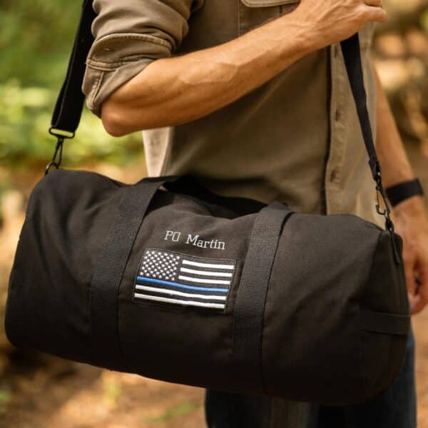 Close-up of the Thin Blue Line flag on the black duffle bag