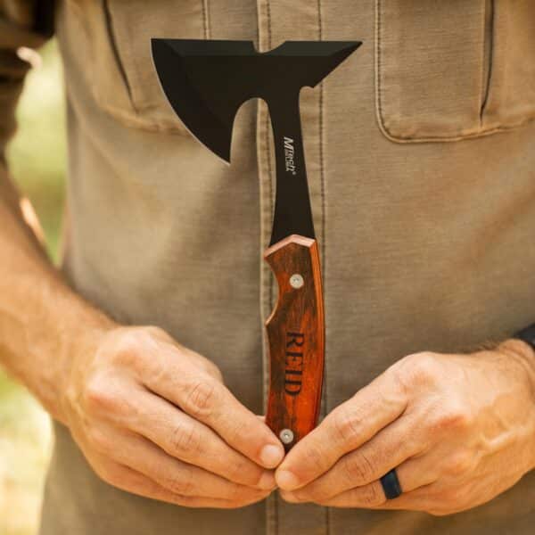 Mini axe shown to scale with a man holding it