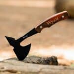 The engraved hatchet stuck in a log