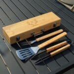Personalized groomsmen BBQ grilling set with engraved bamboo case and stainless steel grill tools.