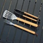 Custom engraved BBQ tool kit for men and groomsmen with durable bamboo storage case for backyard grilling