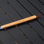 Close-up of laser engraving on grill fork bamboo handle