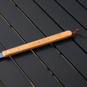 Close-up of laser engraving on grill fork bamboo handle