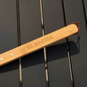 Close-up of engraved bamboo wood handle