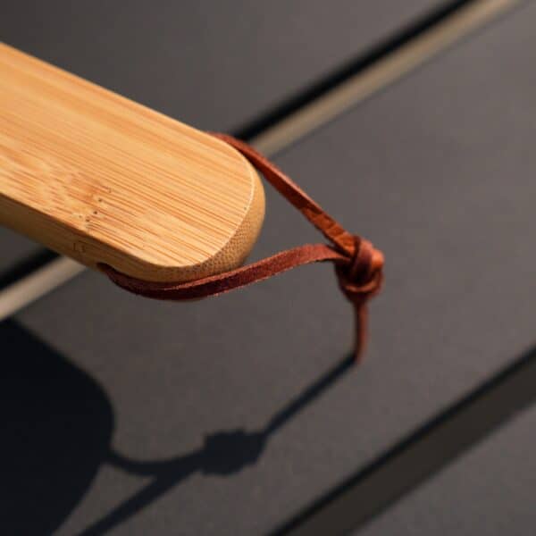Leather strap on end of grill fork handle for easy hanging