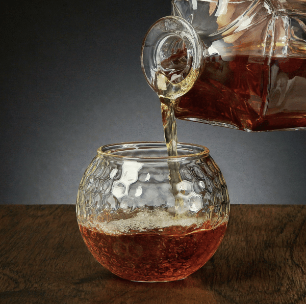 Pour your groomsmen a bourbon in this custom golf ball glass