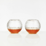 The Par Excellence Set includes two glasses crafted to look like golf balls.