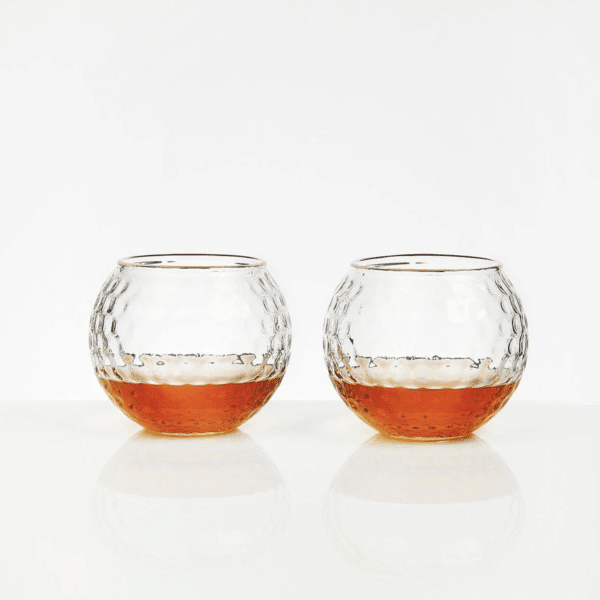The Par Excellence Set includes two glasses crafted to look like golf balls.