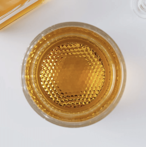 The decanter and whiskey glasses feature a 3D dimpled golf ball-like bottom
